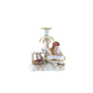 Figural porcelain candlestick with putto and gilding, Art Deco style, Europe